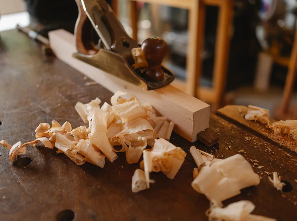 Close-up of skilled carpentry detail, a tight mitered joint on fresh-cut wood by LLS Construction